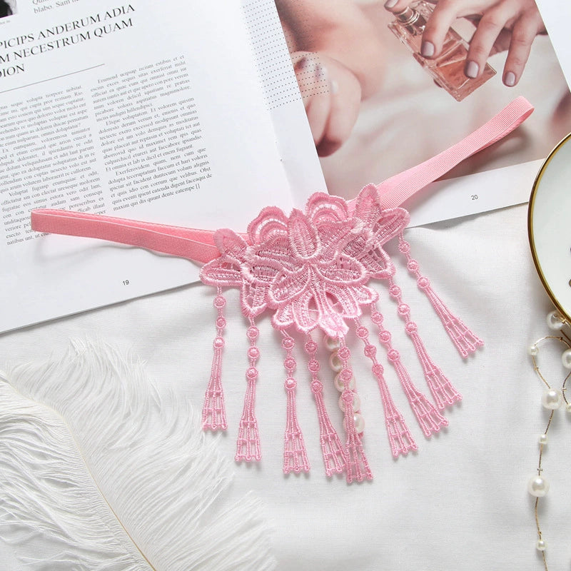 Embroidered low waist pearl massage crotchless thong