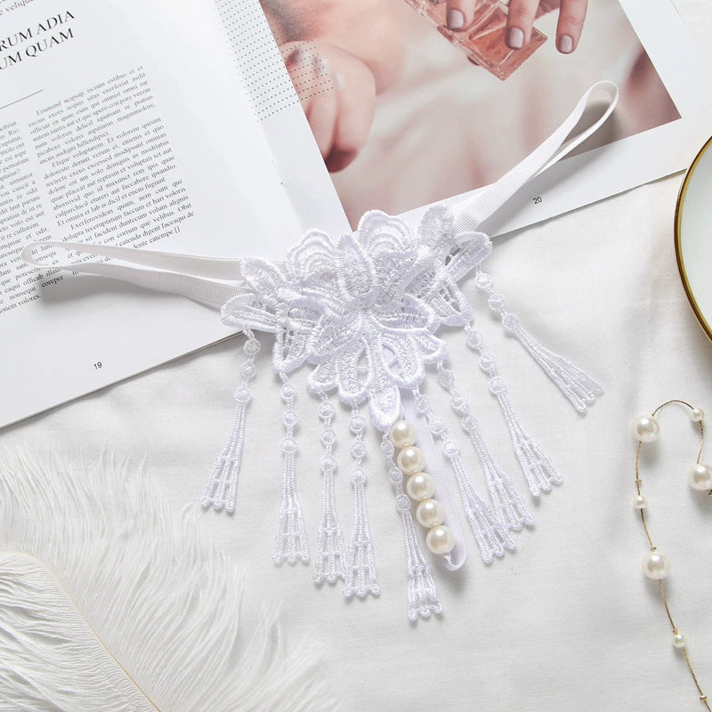 Embroidered low waist pearl massage crotchless thong