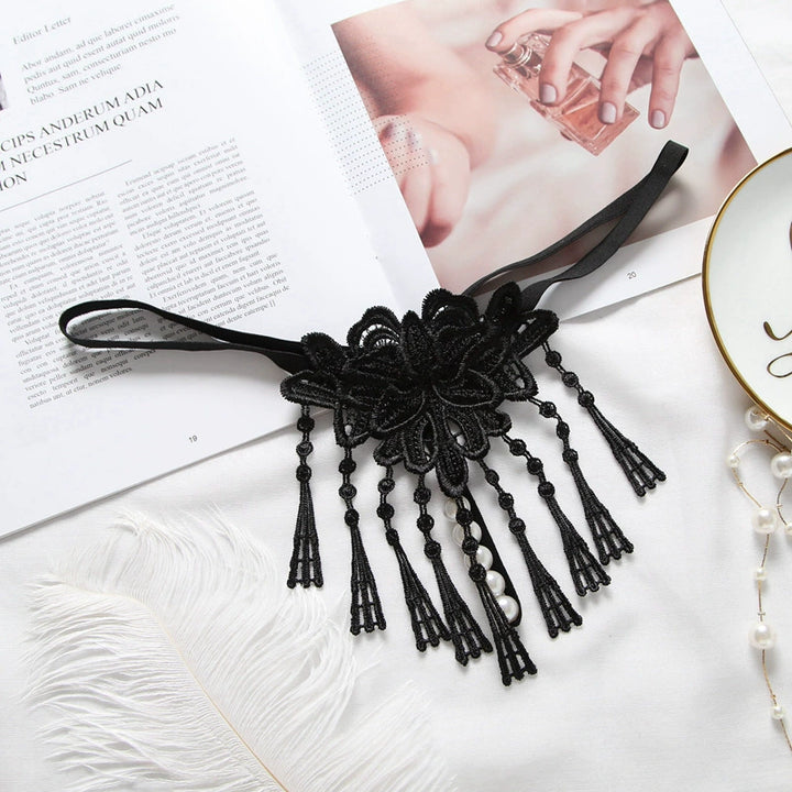 Embroidered low waist pearl massage crotchless thong