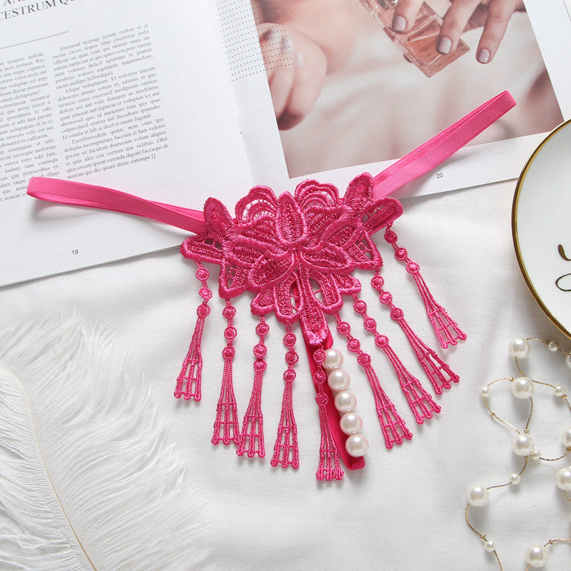 Embroidered low waist pearl massage crotchless thong