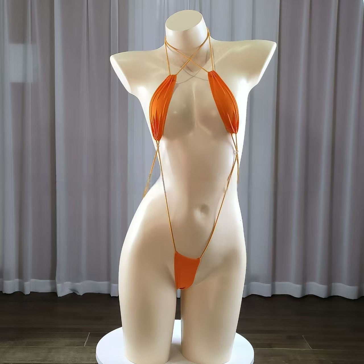 Sexy strappy women's lingerie set, seductive bodysuit.