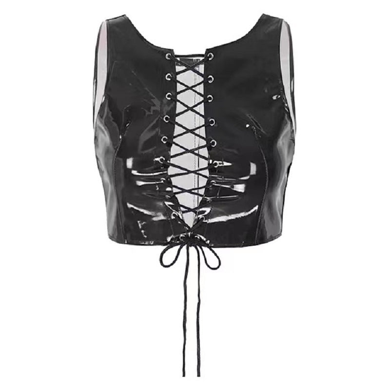 Mirror-finish leather pants, skinny trousers, and a patent leather cutout vest with exposed chest.