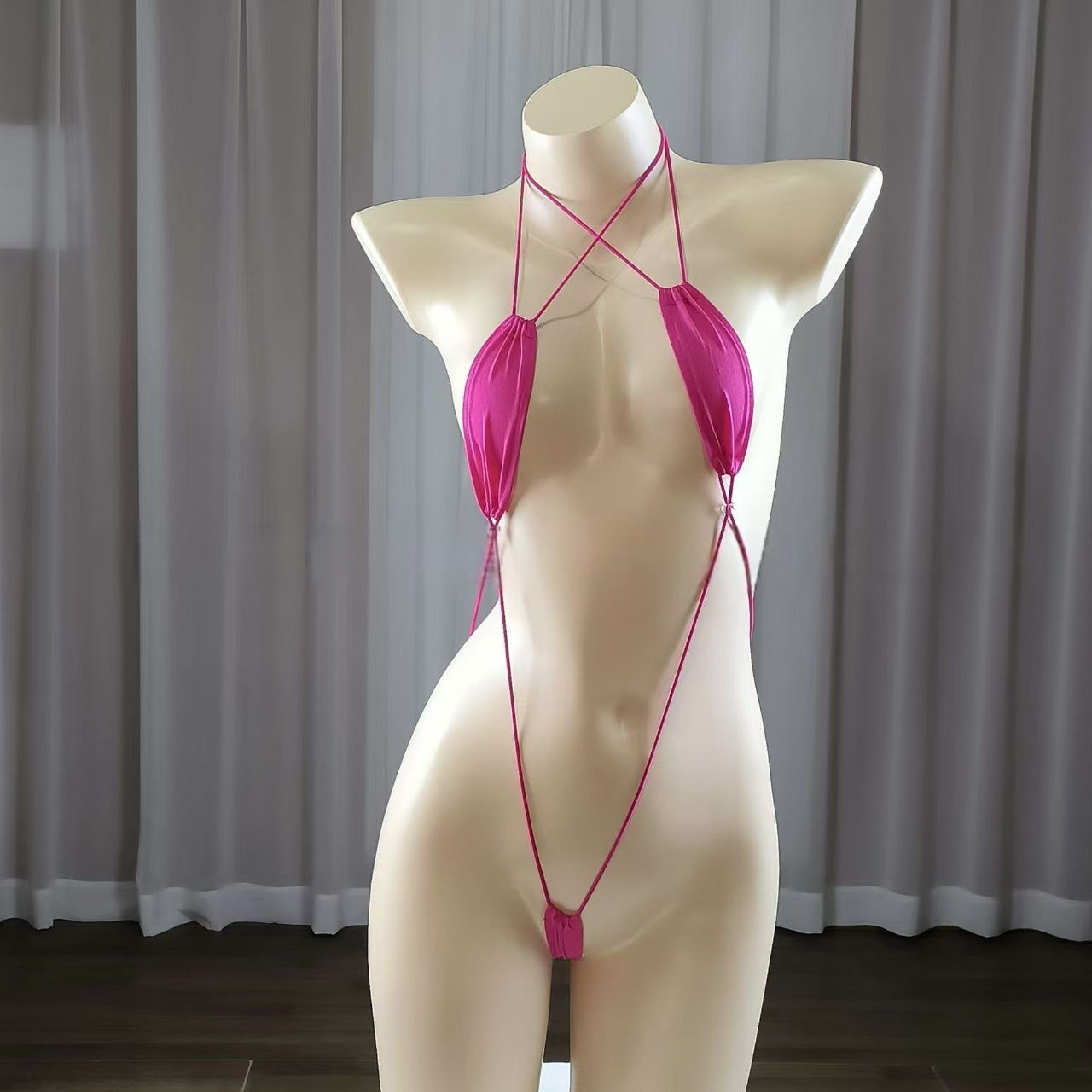 Sexy strappy women's lingerie set, seductive bodysuit.