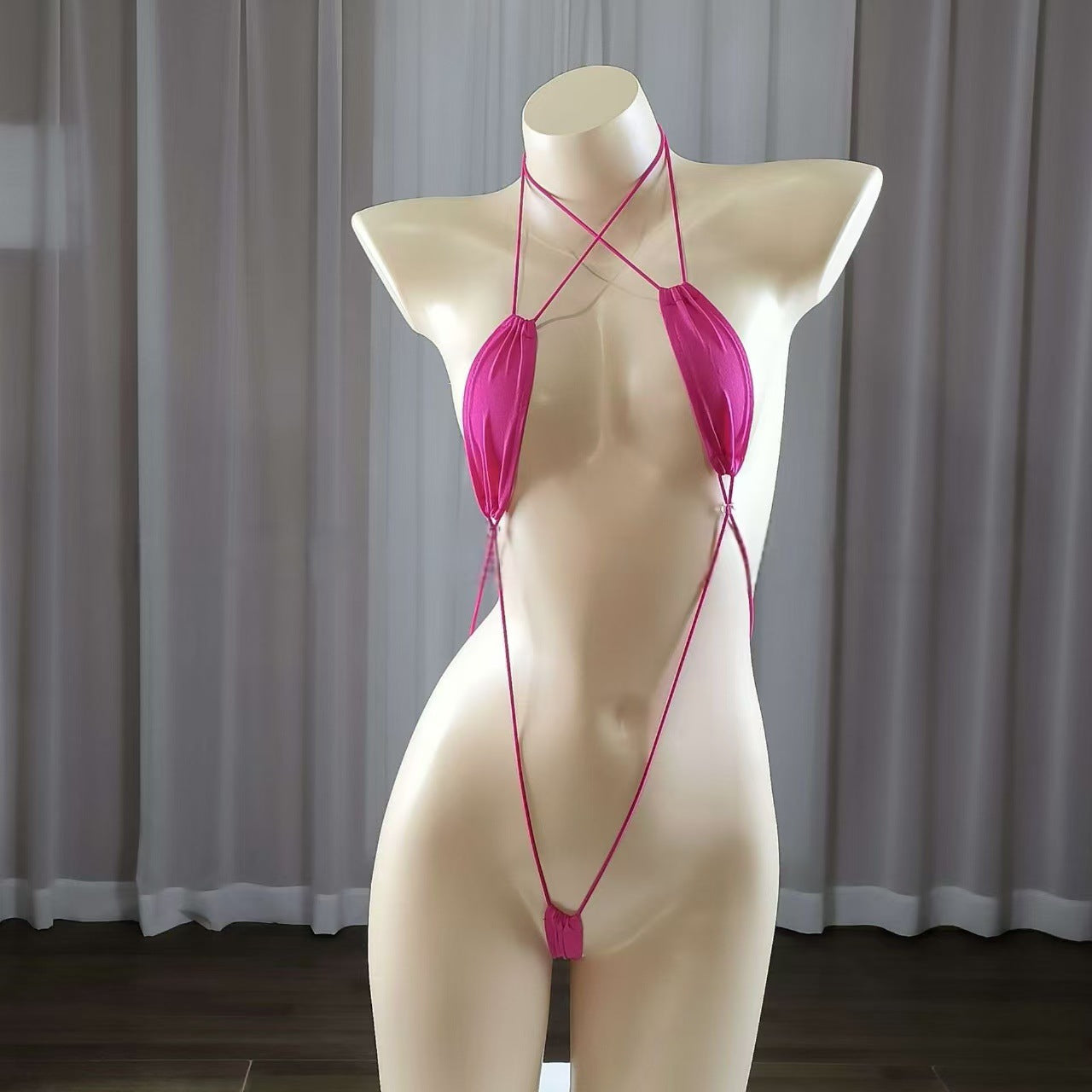 Sexy strappy women's lingerie set, seductive bodysuit.